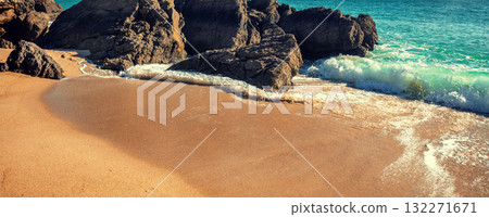 Rocky seascape on a sunny day. View of a rocky beach in Setubal, Portugal. Horizontal banner. 132271671