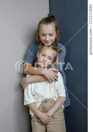 Pretty little girl and boy playing indoor. Cute children together Pretty little girl and boy playing indoor. Cute children together 132271680