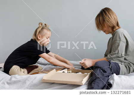 Cute children are ready to play chess at home Cute children are ready to play chess at home 132271681