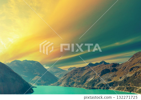 Top view of a mountain lake Kolnbreinspeicher at sunset. Gamskarnock, Austria Europe 132271725