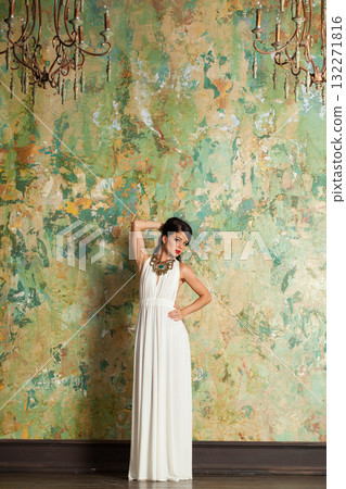 Attractive young female model brunette looking at camera indoor, full length portrait Attractive young female model brunette looking at camera indoor, full length portrait 132271816