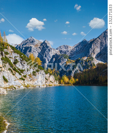 Sunny autumn alpine Tappenkarsee lake and rocky mountains above, Kleinarl, Land Salzburg, Austria. Sunny autumn alpine Tappenkarsee lake and rocky mountains above, Kleinarl, Land Salzburg, Austria. 132271833