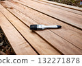 Paint brush and wood material in construction work. 132271878