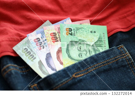 Thai baht money bills in denims pocket close up. The concept of fashion and wealth 132272014