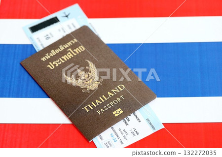 Thai passport and boarding pass tickets on flag close up. The concept of travel and vacation Thai passport and boarding pass tickets on flag close up. The concept of travel and vacation 132272035