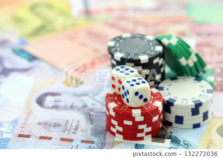 Thai baht currency money bills and casino chips with dices. The concept of gambling and poker casino games 132272036