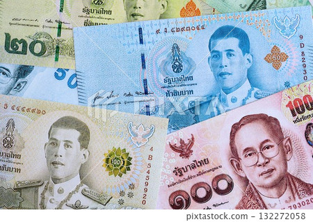 Thai baht currency money bills. The current banknotes lies on table in big amount close up Thai baht currency money bills. The current banknotes lies on table in big amount close up 132272058