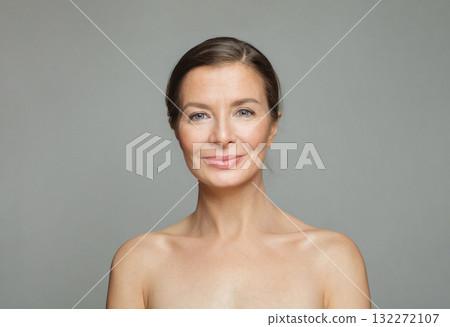 Gorgeous mid aged mature woman looking at camera and smiling. Healthy face skin care beauty 132272107