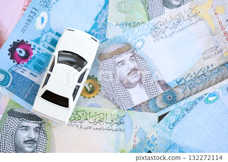 Bahraini dinar currency money bills and toy car close up. The concept of car ownership 132272114