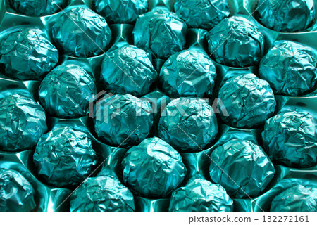 Golden candies in a big box 132272161