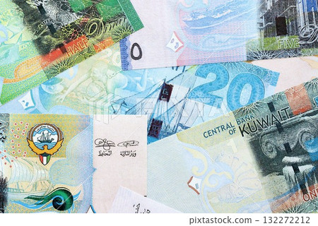 Kuwaiti dinar currency money bills. The current banknotes lies on table in big amount close up Kuwaiti dinar currency money bills. The current banknotes lies on table in big amount close up 132272212
