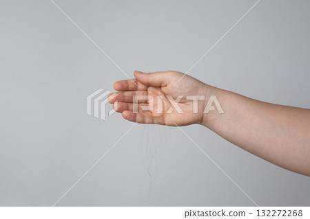 Woman holding hair closeup. Hair loss problem 132272268