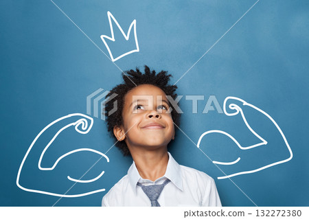 Child Boy in a White Shirt and Tie Joyfully Poses Against a Blue Background With Drawn Muscles  Child Boy in a White Shirt and Tie Joyfully Poses Against a Blue Background With Drawn Muscles  132272380