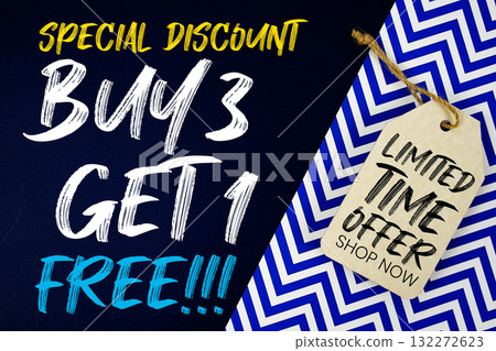 Buy 3 Get 1 Free!!! with Limited Time Offer text on price tag on dark navy blue and blue chevron background 132272623