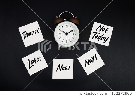 Alarm Clock Surrounded with Tomorrow, Later, Now, Next, Not Today 132272969