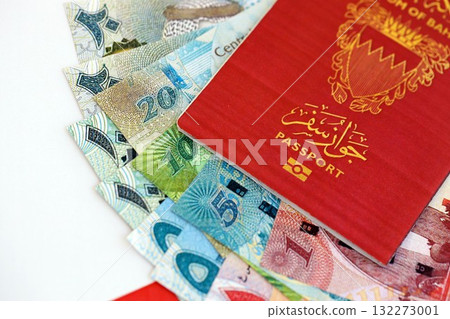 Bahraini dinar currency money bills and passport lies on flag close up. The concept of travel and vacation 132273001
