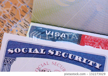 The American visa in a blurred passport page background and social security number personal document. SSN - social security number for live in USA 132273029
