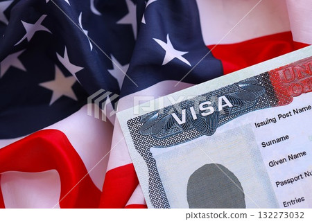 United States flag and United States visa. Concept of Immigration and Travel to the United States. Visa in the passport on the background of the American flag 132273032