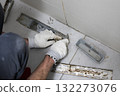 Mold damage problem in bathroom. Worker repairing sewer and bathroom drain 132273076