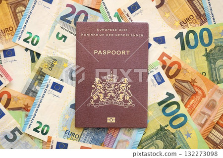 Netherlands passport lies on big amount of euro money banknotes close up. Rich life and travel in Europe concept Netherlands passport lies on big amount of euro money banknotes close up. Rich life and travel in Europe concept 132273098