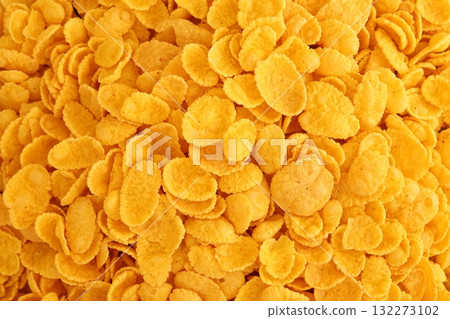 Corn flakes background texture close up. Top view cornflake cereal box for morning breakfast 132273102
