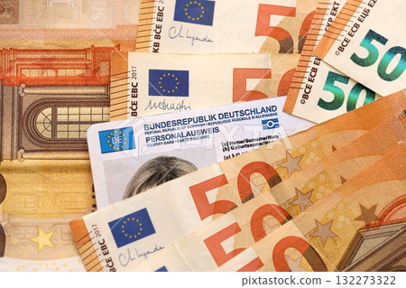 Official German Personalausweis Identity Card as a Symbol of Citizenship among euro money bills close up 132273322