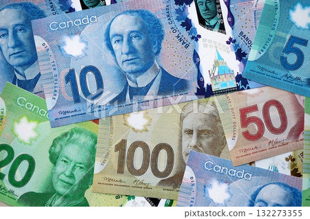Canadian Dollar currency money bills. CAD currency banknotes in big amount with different denomination close up Canadian Dollar currency money bills. CAD currency banknotes in big amount with different denomination close up 132273355