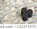 Barrels of oil on bills of American dollars. purchase, sale of oil concept close up 132273371