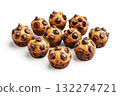 Pile of chocolate chip muffins isolated on solid white background. Muffins with golden-brown tops and scattered dark chocolate chips. Neutral lighting enhances texture. Neural network AI generated 132274721