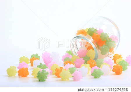 Japanese Sweets 14 Colorful sugar candy spilling from a glass jar Japanese Sweets 14 Colorful sugar candy spilling from a glass jar 132274758