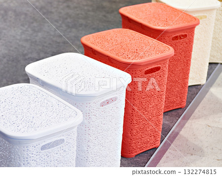 Plastic laundry baskets in store 132274815