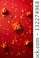 Amber liquid with moist plant petal tints on terrestrial background 132274968