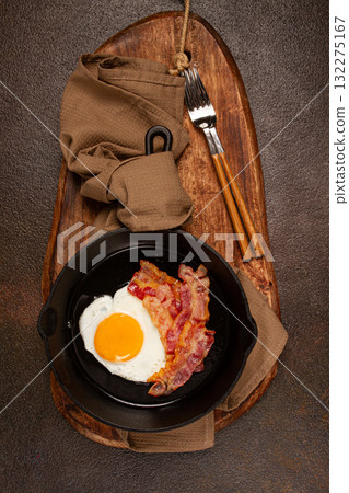 fried egg with bacon, in a cast-iron pan, breakfast, top view, close-up, homemade, no people, fried egg with bacon, in a cast-iron pan, breakfast, top view, close-up, homemade, no people, 132275167