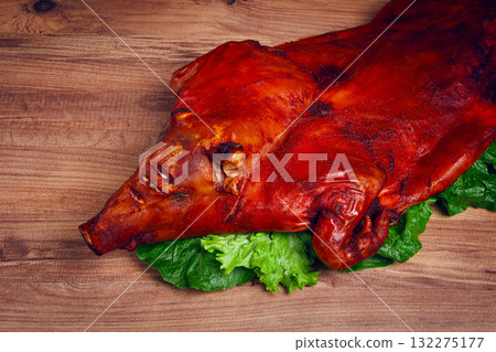 Baked, fried piglet, on a wooden table, no people, Baked, fried piglet, on a wooden table, no people, 132275177
