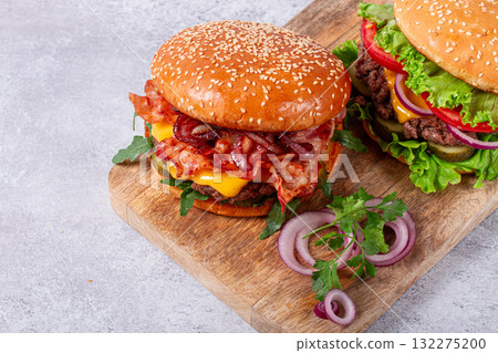 two burgers with beef patty, fried bacon, cheddar cheese, tomatoes, homemade, no people, two burgers with beef patty, fried bacon, cheddar cheese, tomatoes, homemade, no people, 132275200