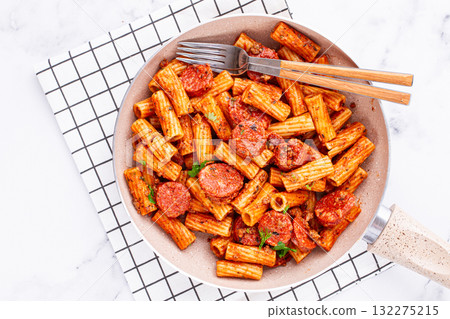 rigatoni pasta with spicy sausage, and rich tomato sauce served, on a white plate, homemade, rigatoni pasta with spicy sausage, and rich tomato sauce served, on a white plate, homemade, 132275215