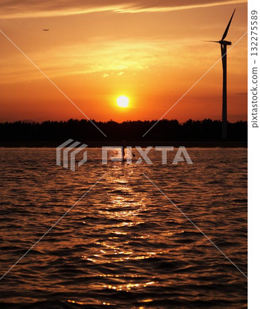 Sunset Paddleboard Wind Turbine Water Evening Sunset Paddleboard Wind Turbine Water Evening 132275589