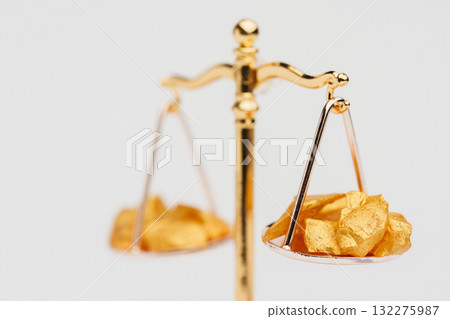 Beautiful Golden Balance Scales with little pieces of gold. Gold cost climbing up. Finance, gold theme 132275987