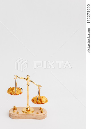Beautiful Golden Balance Scales with little pieces of gold. Gold cost climbing up. Finance, gold theme Beautiful Golden Balance Scales with little pieces of gold. Gold cost climbing up. Finance, gold theme 132275990