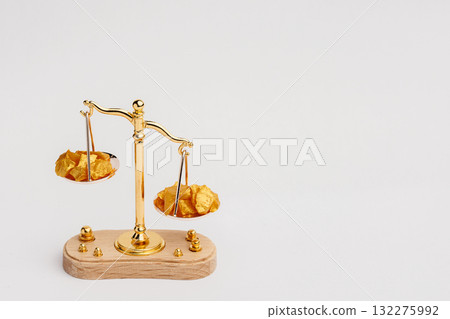 Beautiful Golden Balance Scales with little pieces of gold. Gold cost climbing up. Finance, gold theme 132275992
