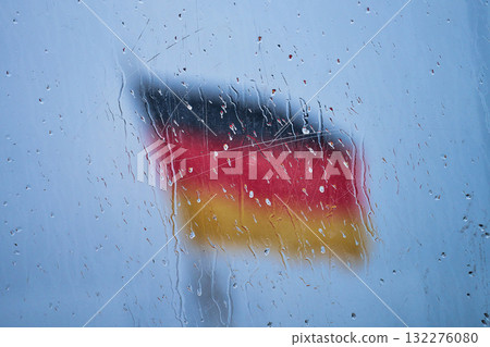 German Flag behind glass with raindrops 132276080