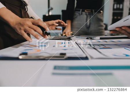 Accounting company provide finance and taxation planning for profitable cash flow, Auditor and accountant team working in office, analyze financial data and accounting record with calculator.Insight 132276864