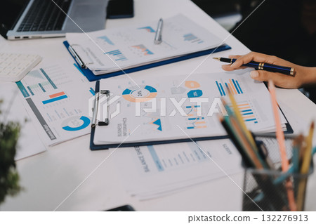 Accounting company provide finance and taxation planning for profitable cash flow, Auditor and accountant team working in office, analyze financial data and accounting record with calculator.Insight 132276913