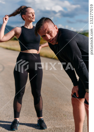 Morning Rest Couple Relaxing After Challenging Run. Morning Rest Couple Relaxing After Challenging Run. 132277059