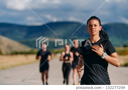 Leader Guiding Athletes on a Sunny Day Run 132277209