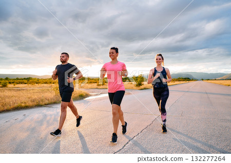 Athlete Leading Group Run at Sunset Amidst Stunning Nature Athlete Leading Group Run at Sunset Amidst Stunning Nature 132277264