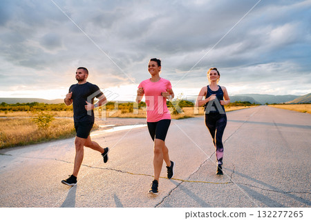 Athlete Leading Group Run at Sunset Amidst Stunning Nature 132277265