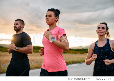 Athlete Leading Group Run at Sunset Amidst Stunning Nature 132277277