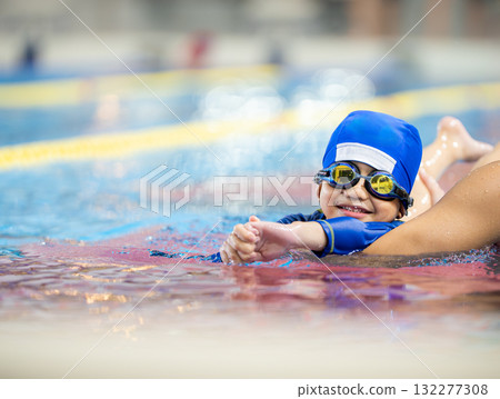 A 5-year-old boy attending swimming lessons A 5-year-old boy attending swimming lessons 132277308
