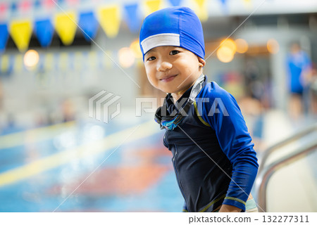 A 5-year-old boy attending swimming lessons 132277311